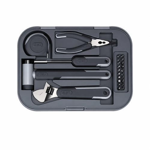 essential home tool set with adjustable wrench hammer pliers screwdriver bits and measuring tape for household repairs and DIY projects