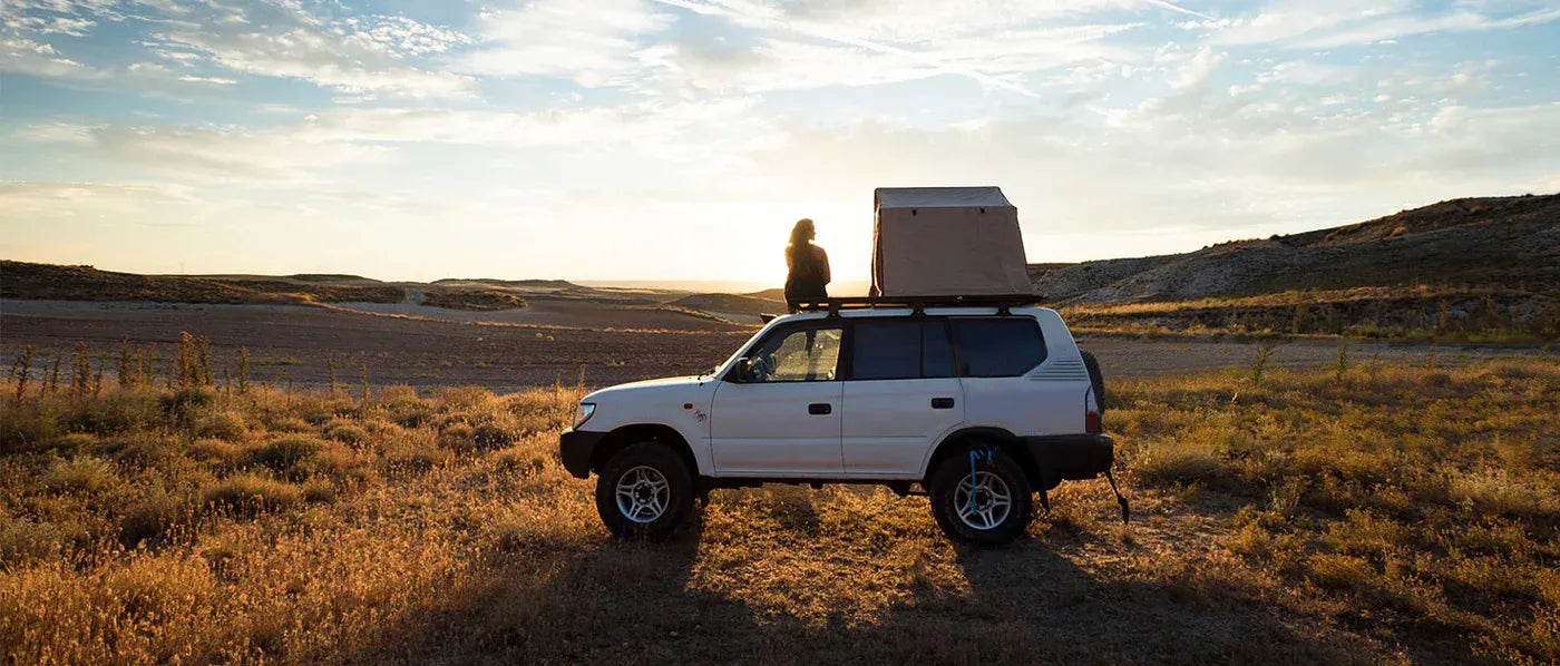 Off-road vehicle exploring desert landscape during outdoor adventure